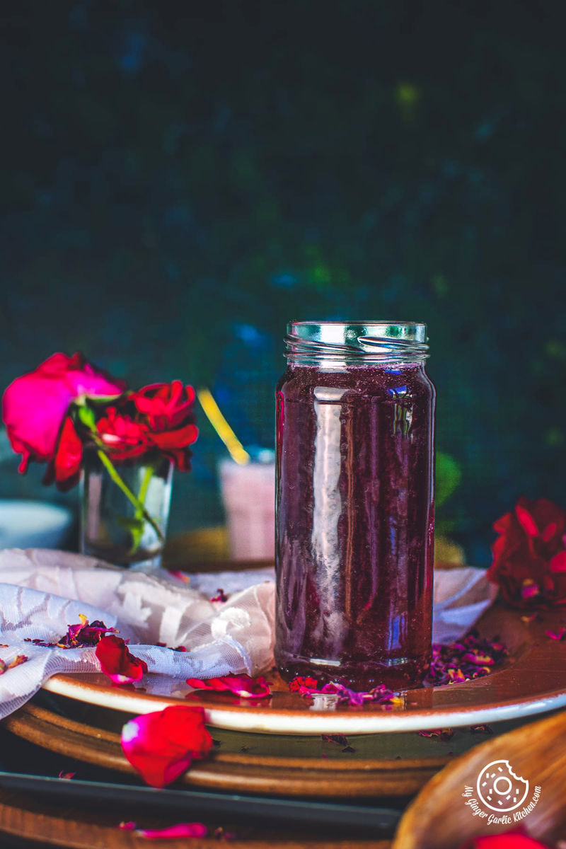 homemade rose syrup in glass bottle